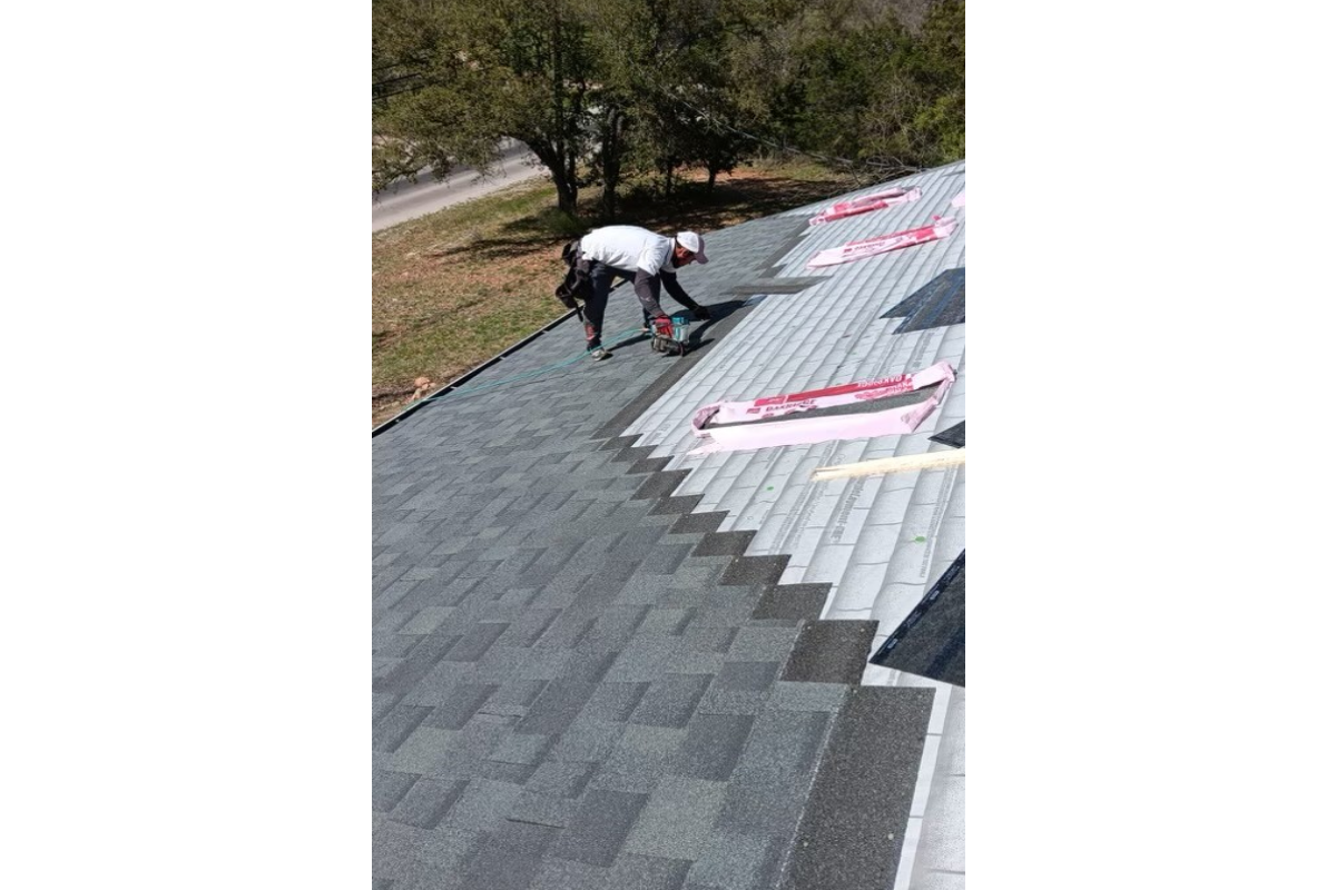 builder who installs floor with large ceramic tiles during repair work remodel contractor 3